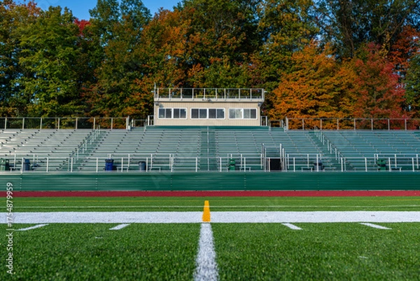 Obraz Photo of the exterior of a press box with roof video platform, from field level.