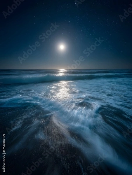 Fototapeta Serene ocean waves bathed in moonlight and stars creating a tranquil night seascape with a glowing reflection on the water s surface