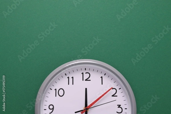 Fototapeta Close-up of a wall clock. The concept of time and work time is valuable for life, Alarm clock stopped. photo in a coloured background