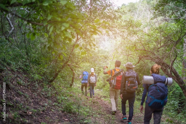 Fototapeta Group tourists hiking on sunny days. subject is soft focus.