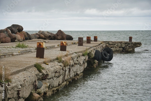 Fototapeta Weathered Concrete Pier on a Gray Baltic Sea Day