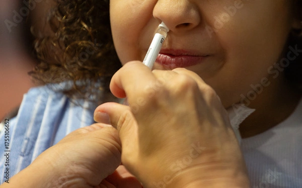 Obraz Flu vaccination campaign. Intranasal flu vaccine for school-aged children.