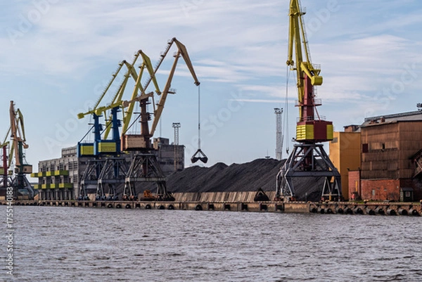Fototapeta Coal terminal in the port. Large cranes at the coal handling terminal