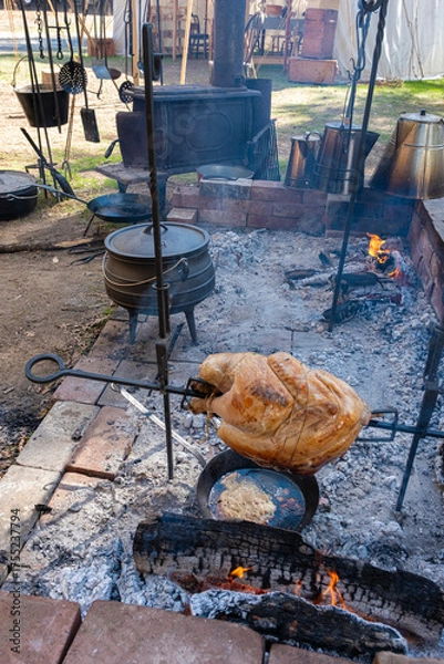 Obraz Turkey Cooking on Spit at a Gold Rush Camp