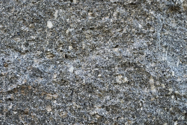 Obraz 黒っぽく表面に凸凹のある石のクローズアップ。石や岩のテクスチャー
