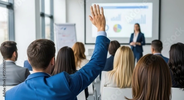 Obraz Audience member raises hand during business presentation