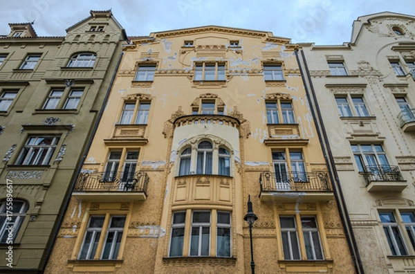 Fototapeta Historic building façade in Old Town Prague with visible damage and weathered details, reflecting the aging beauty and heritage of European architecture