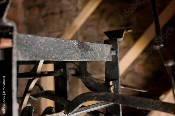 Obraz Antique church clock mechanism with metal gears. Perfect for illustrating vintage machinery, time concepts, history, or industrial design.