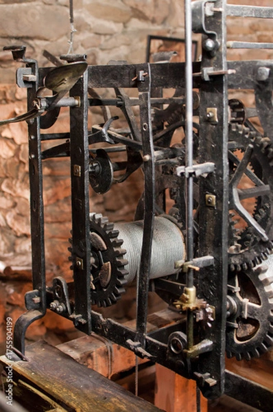 Obraz Antique church clock mechanism with metal gears. Perfect for illustrating vintage machinery, time concepts, history, or industrial design.