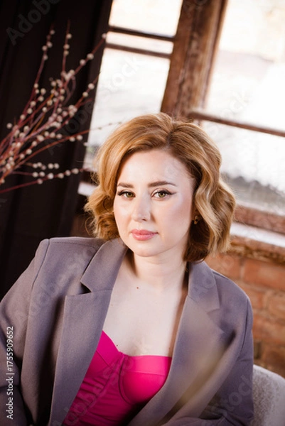Fototapeta a young woman posing in a photo studio
