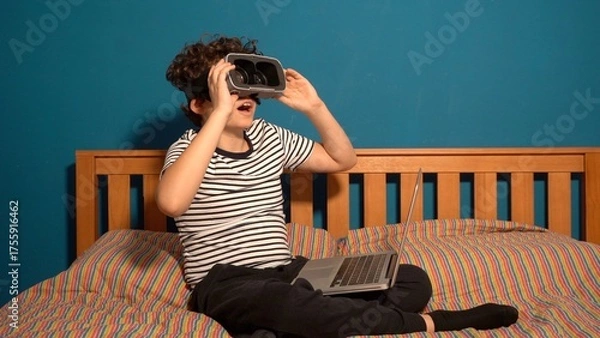 Fototapeta Little boy Immersed in cyberspace, metaverse, learning in virtual reality. Kid playing games. Child learning using virtual reality headset. Education child in virtual reality glasses. laptop and globe