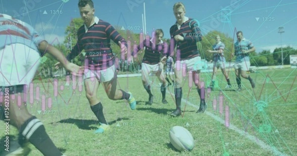 Fototapeta Sprinting rugby players in striped and plain jerseys chasing ball on pitch with candlestick overlay