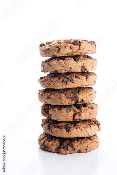 Fototapeta vertical stack of chocolate chip cookies piled on a white background