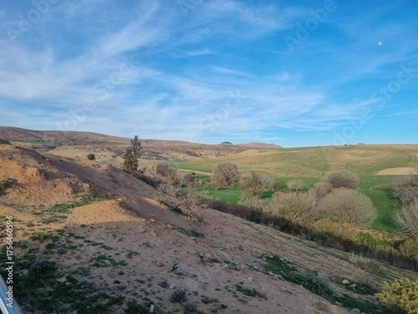 Fototapeta Rural landscape with abandoned building and cultivated fields