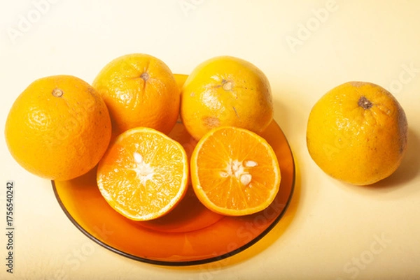Fototapeta oranges on a yellow background
