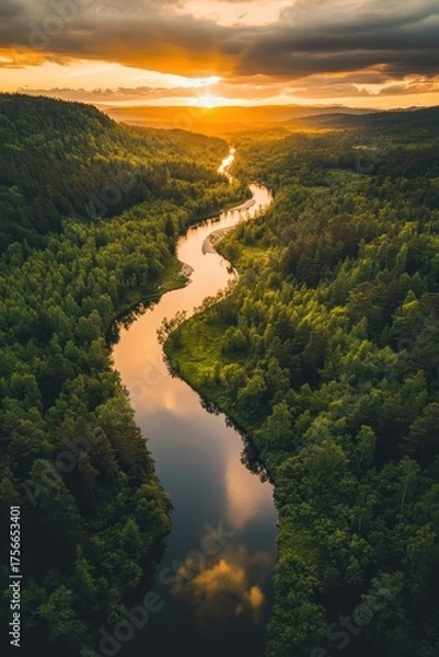 Obraz A river surrounded by trees at sunset