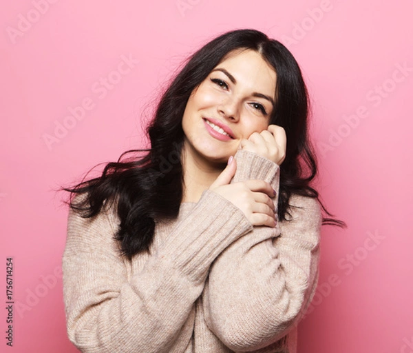 Obraz Attractive caucasian smiling brunette woman over pink background.