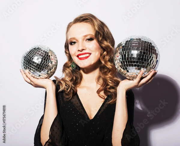 Obraz Beautiful young woman holding disco ball