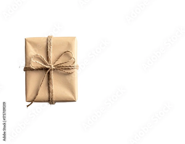Fototapeta A single, square gift wrapped in brown paper and tied with twine against a black background