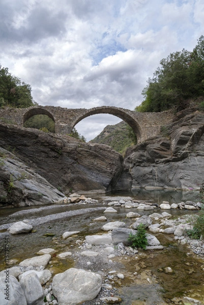 Obraz Old stone arch bridge in Ligurian Alps mountains, Molini di Triora municipality, Imperia province, Italy