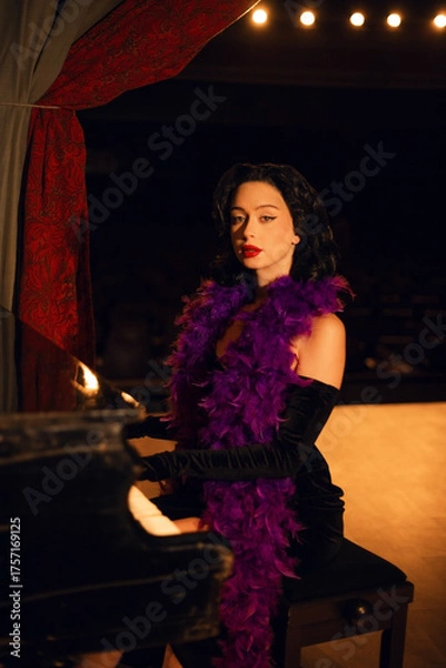 Fototapeta Piano performance by a singer in glamorous attire on stage during an evening event