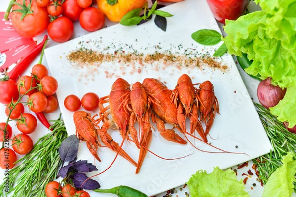 Obraz boiled crayfish large on a white plate on a table with food decor