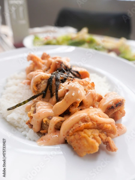 Fototapeta A plate of homemade Japanese Chicken Karaage served with Mentai sauce and white rice