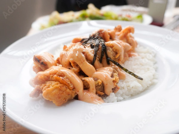 Fototapeta A plate of homemade Japanese Chicken Karaage served with Mentai sauce and white rice