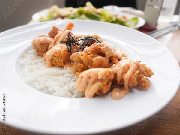 Fototapeta A plate of homemade Japanese Chicken Karaage served with Mentai sauce and white rice