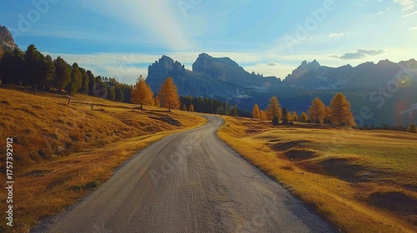 Fototapeta An inspiring autumn scene that captures the harmony between earth, road, and sky