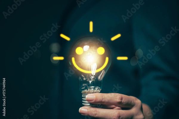 Obraz Glowing light bulb in hand, idea search concept Creativity from information trade in the internet world, marketing, business ideas and target groups.