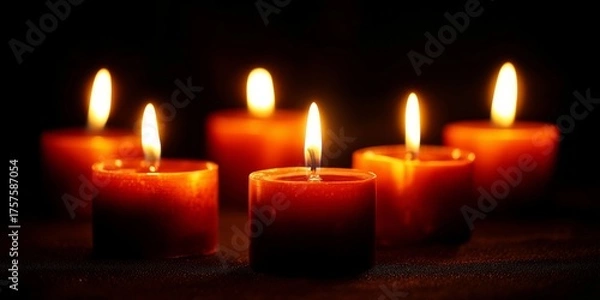 Fototapeta A Serene Display of Flickering Candle Flames Illuminating a Dark Space with Warmth and Tranquility, Creating an Atmosphere of Calmness and Reflection