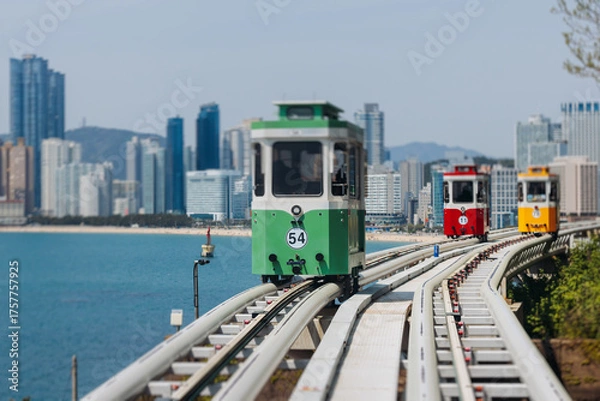 Fototapeta Haeundae Blue Line Park, Busan, ride on multicoloured sky capsule train, railway tram route from Mipo to Cheongsapo station, coastal monorail in Busan, Yeongnam, South Korea, Republic of Korea travel