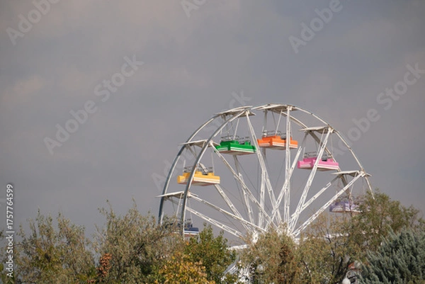 Obraz Section of a colorful ferris wheel in the amusement park.