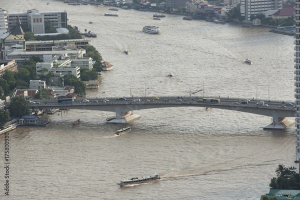 Fototapeta Aerial view of boats and ferries on Chao Phraya river in Bangkok city