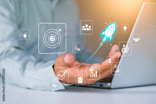 Fototapeta Business growth to target. Startup new project. Rocket launching from laptop to business icon. Represent strategic planning, Goal setting. Investment management. Company strategy. Business vision