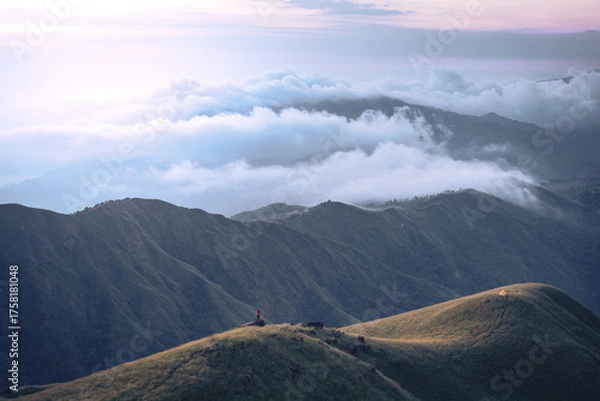 Fototapeta A man with his tent is taking a view of Mountain Range view point in Myanmar (Burma) with sea of cloud (Mulayit Taung) and sunrise