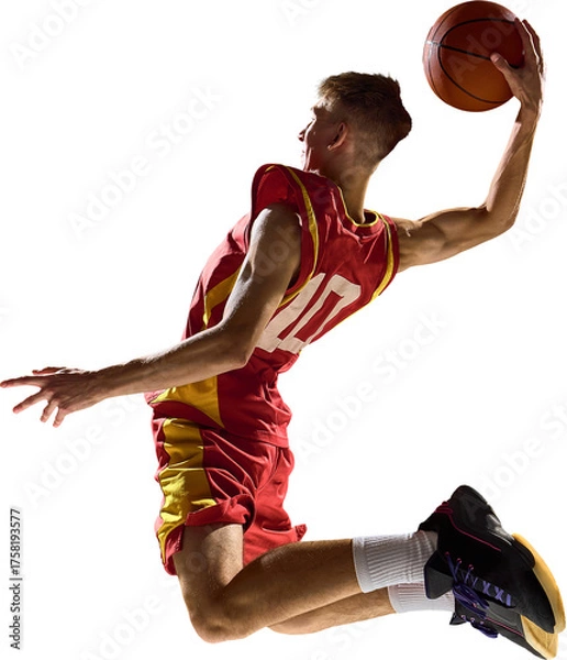 Fototapeta Basketball player in mid air twisting body preparing slam dunk on transparent background. Concept of discipline, balance, determination capturing power, energy, and control.