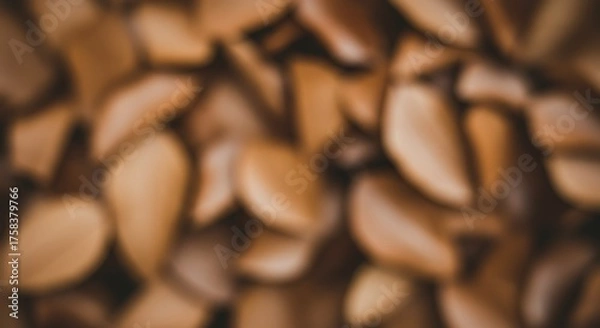 Obraz Close up of numerous almond halves creating a natural brown background