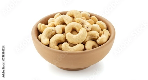 Obraz Close up of roasted cashew nuts in a small bowl on a white background