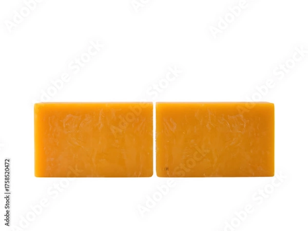 Fototapeta Yellow Soaps Duo: A pristine presentation of two rectangular bars of vibrant yellow soap. Their clean lines and smooth surfaces create a visual appeal.