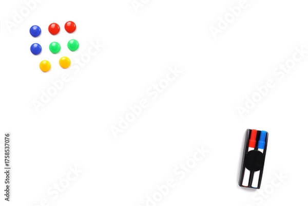 Fototapeta Whiteboard with colorful magnets and markers. Blank background with copy space.