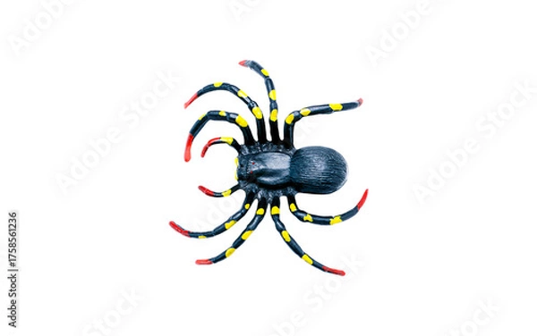 Obraz A plastic toy spider with a black body and legs marked with yellow dots and red tips. Isolated on a transparent background, perfect for Halloween, prank, or fear concepts. Top view