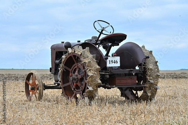 Fototapeta vintage tractor in the field agriculture machinery	
