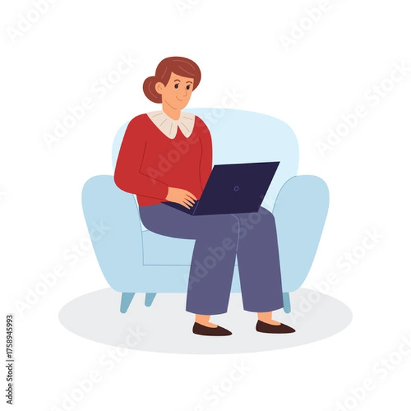 Obraz Woman working on laptop while sitting on armchair