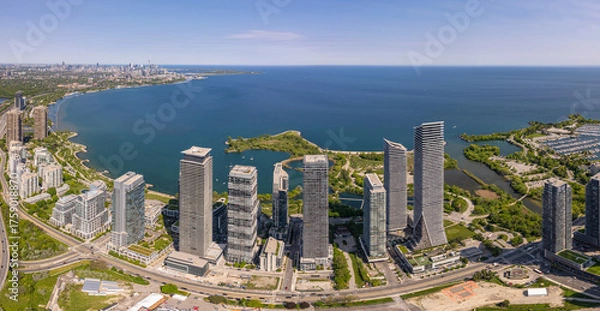 Fototapeta Aerial view of waterscapes condos at Marine Parade Drive near Humber Bay Park and close to the Ontario lakefront in Etobicoke. Mimico scenic waterfront parks for leisure and fishing. Toronto West.