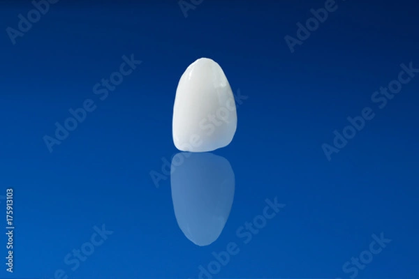 Obraz Ceramic crown on blue background