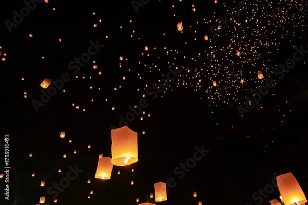 Fototapeta Floating lanterns take place during Thailand's Loi Krathong festival on the night of the full moon.