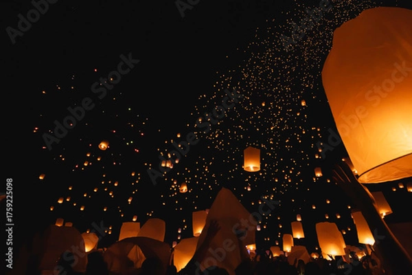 Fototapeta Floating lanterns take place during Thailand's Loi Krathong festival on the night of the full moon.