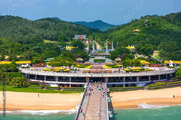 Fototapeta Nanshan Buddhist Cultural Park, Sanya, Hainan Island, China.  The bridge leads to a Buddha statue.